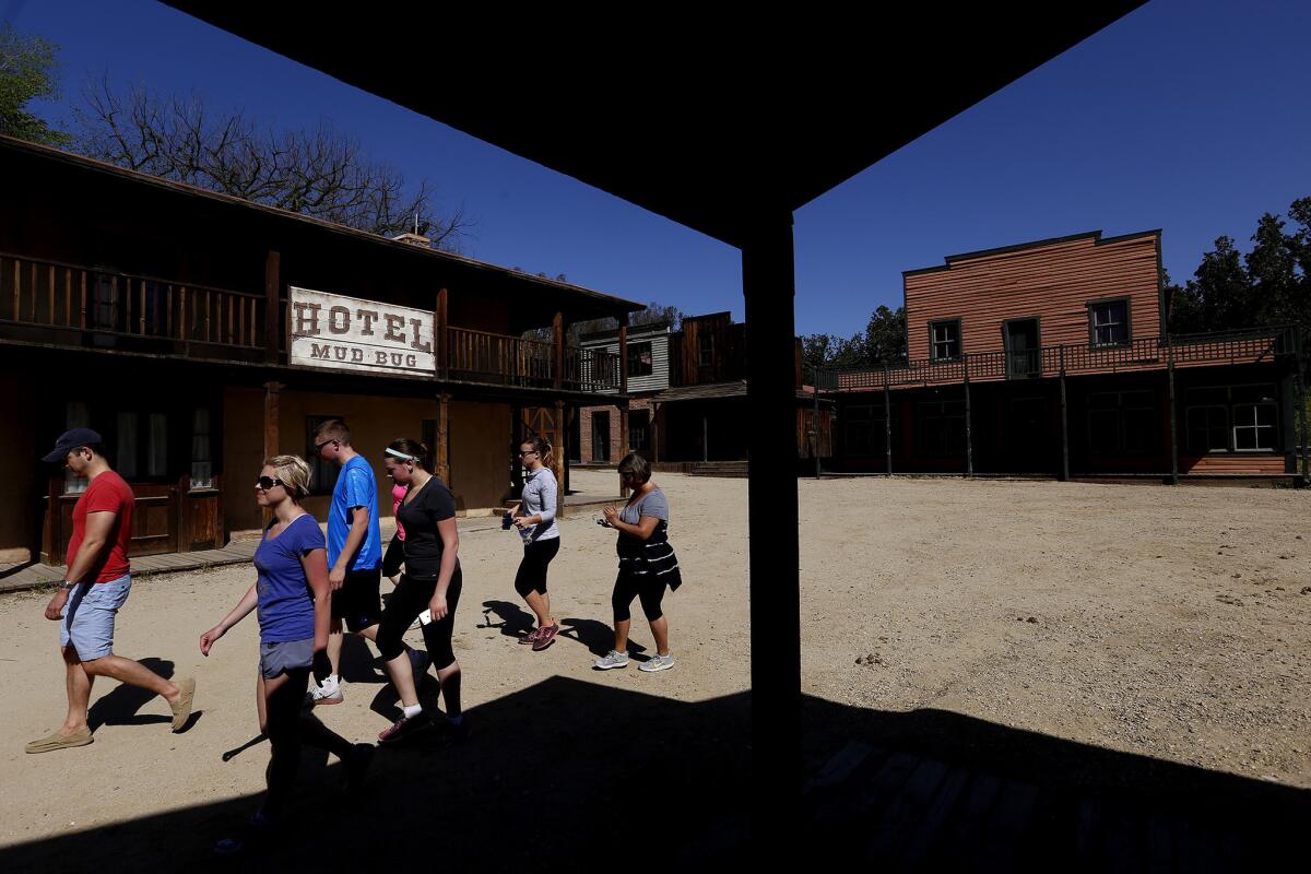 Visitors walk through Western Town at Paramount Ranch, which includes the Hotel Mud Bug, in Agoura Hills. Paramount Ranch, part of the Santa Monica Mountains National Recreation Area, has been a working movie ranch since 1927, serving as the backdrop for Cisco Kid, Hopalong Cassidy and Dr. Quinn, Medicine Woman.