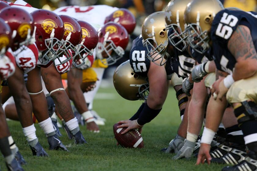 SOUTH BEND, IN - OCTOBER 17: Braxston Cave #52 of the Notre Dame Fighting Irish prepares to snap the ball against the USC Trojans during the second quarter at Notre Dame Stadium on October 17, 2009 in South Bend, Indiana. (Photo by Jonathan Daniel/Getty Images)