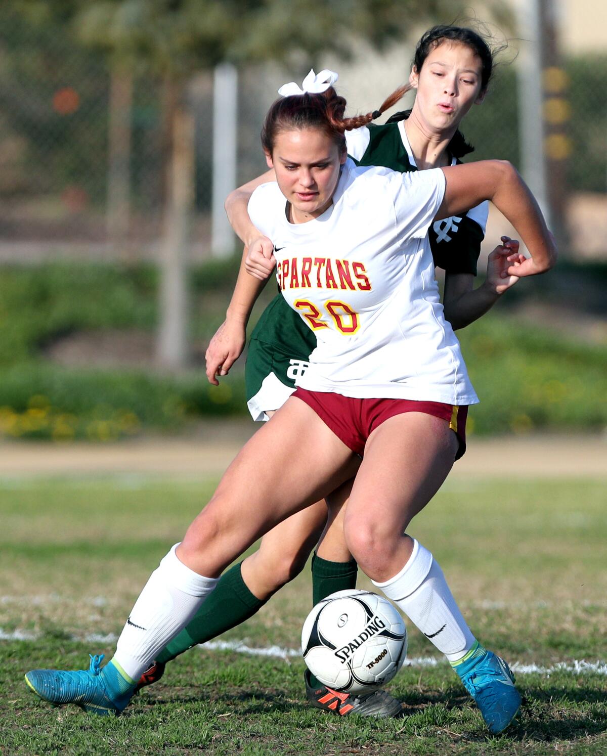 La Canada High School girls soccer player Haley Decker keeps the defender away from the ball in game vs. Temple City High in Temple City on Wednesday, Jan. 22, 2020.