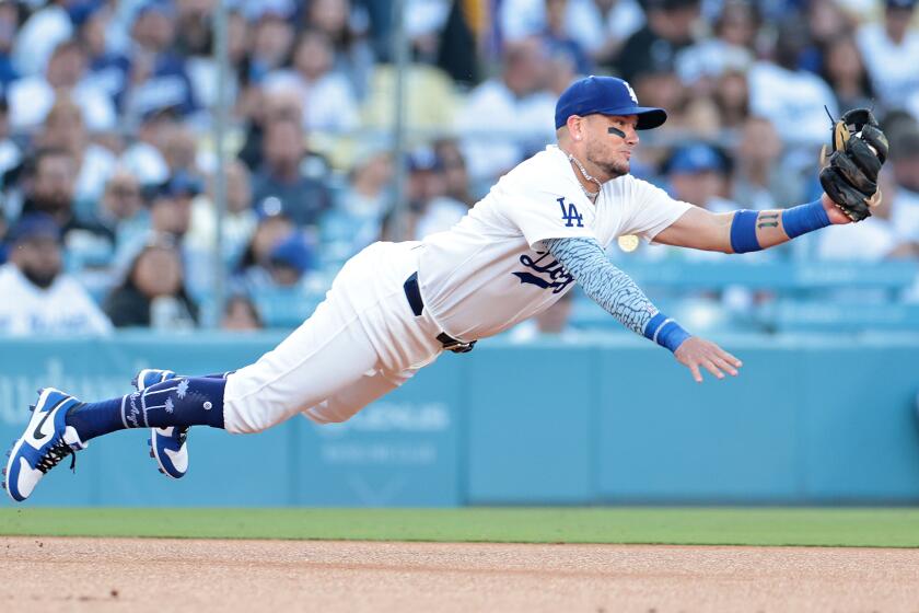 LOS ANGELES CALIFORNIA CALIFORNIA-Dodgers Miguel Rojas dives to make a catch.