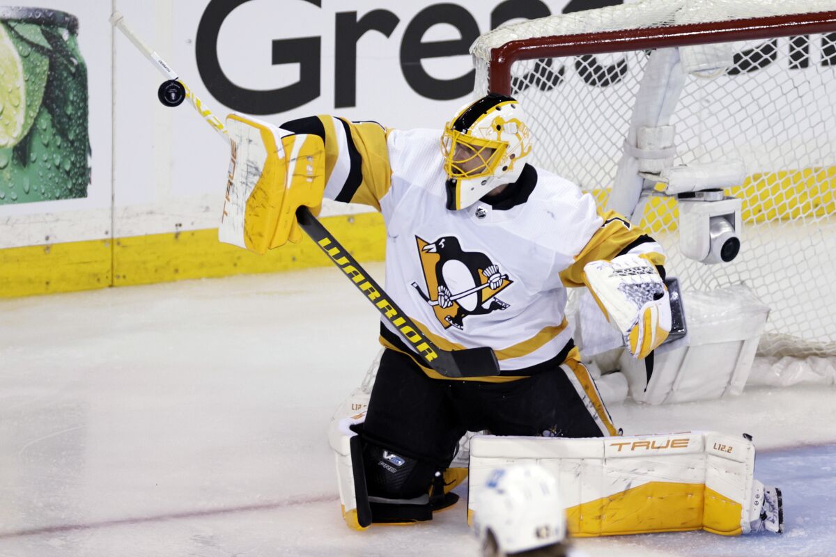 Pittsburgh Penguins goaltender Casey DeSmith makes a save against the New York Rangers in overtime of Game 1 of an NHL hockey Stanley Cup first-round playoff series, Tuesday, May 3, 2022, in New York. (AP Photo/Adam Hunger)