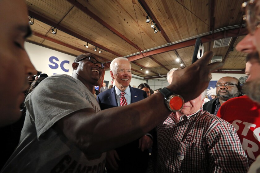 Former Vice President Joe Biden greets supporters after speaking Tuesday night at a campaign event in Columbia, S.C.
