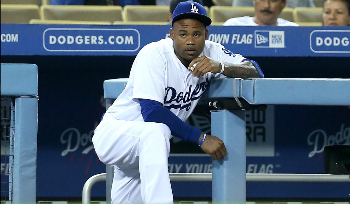 Dodgers outfielder Carl Crawford watches a game against the San Diego Padres after returning from the disabled list Thursday.