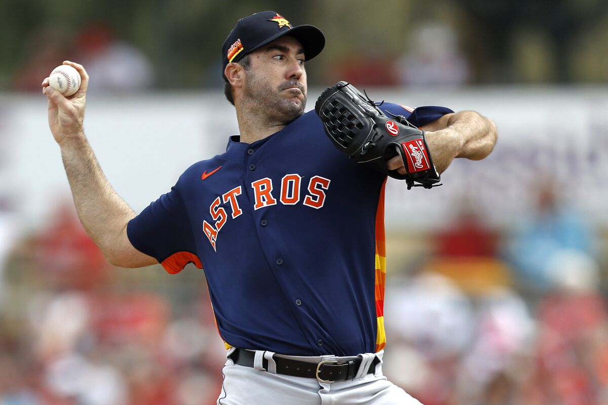FILE - Houston Astros pitcher Justin Verlander throws to the St. Louis Cardinals during the first inning of a spring training baseball game on March 3, 2020, in Jupiter, Fla. Verlander has agreed to a $25 million, one-year contract with the Astros that includes a conditional $25 million player option for a second season. (AP Photo/Julio Cortez, File)