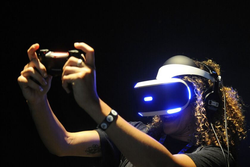 Sianna Hasenberg tries out Sony’s Project Morpheus at E3. Virtual reality headsets aren’t light.
