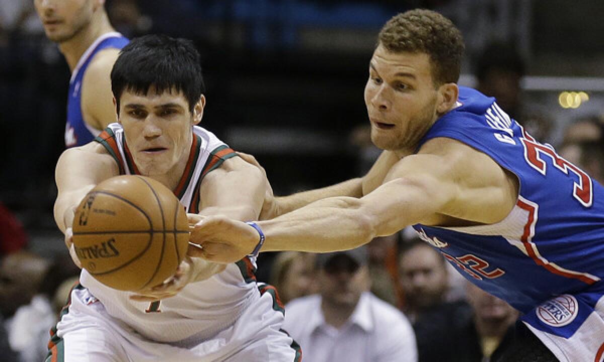 Clippers power forward Blake Griffin, right, steals the ball from Milwaukee Bucks forward Ersan Ilyasova during the Clippers' win Jan. 27.