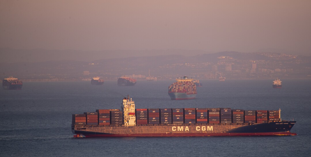 Dozens of container ships sit off the coast of the Ports of Los Angeles and Long Beach, waiting to be unloaded Wednesday.