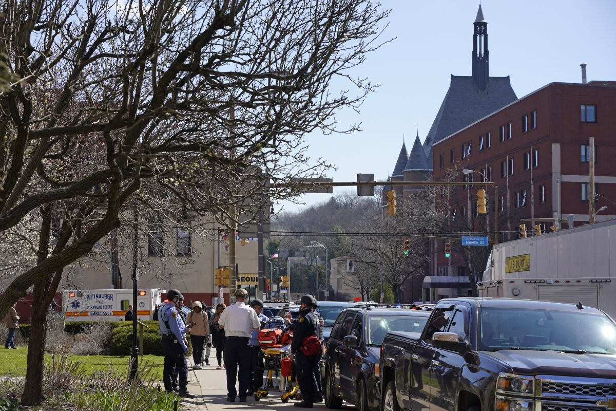 Pittsburgh Police and paramedics respond to Pittsburgh Central Catholic High School for what turned out to be a hoax report of an active shooter, on Wednesday, March 29, 2023 in the Oakland neighborhood of Pittsburgh. (AP Photo/Gene J. Puskar)
