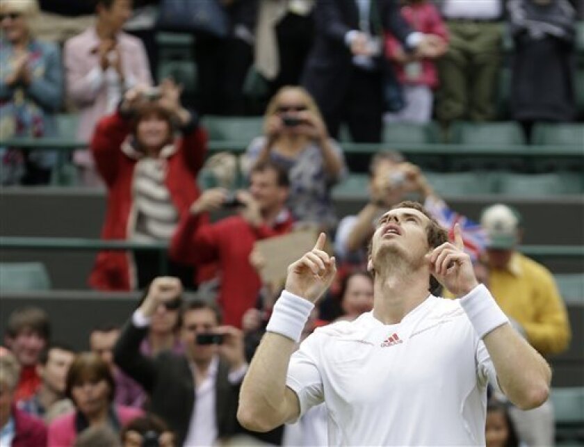 Andy Murray of Britain reacts after defeating Marin Cilic of Croatia during a fourth round singles match at the All England Lawn Tennis Championships at Wimbledon, England, Tuesday, July 3, 2012. (AP Photo/Kirsty Wigglesworth)