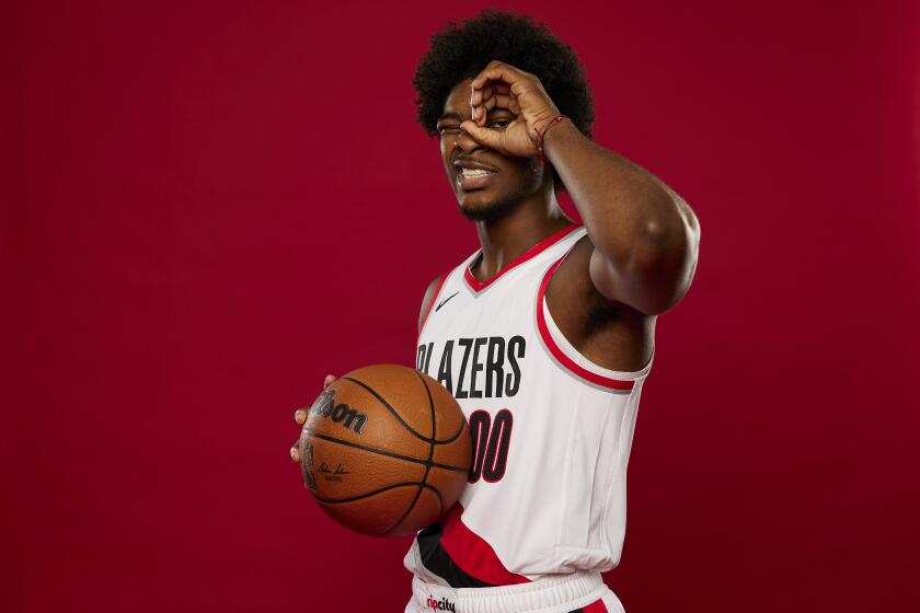 Portland Trail Blazers guard Scoot Henderson poses for a portrait during the NBA basketball team's media day in Portland, Ore., Monday, Oct. 2, 2023. (AP Photo/Craig Mitchelldyer)