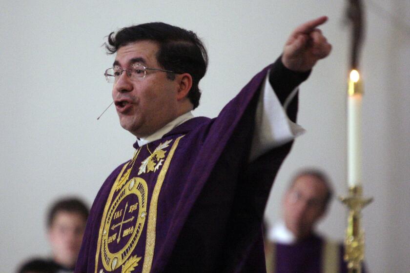 FILE - Frank Pavone, head of Priests for Life, gives the Homily during a mass at Ave Maria University's Oratory in Naples, Fla., on March 31, 2009 to recognize the fourth anniversary of Terri Schiavo's death. The Vatican has defrocked an anti-abortion U.S. priest, Frank Pavone, for what it said were “blasphemous communications on social media” as well as “persistent disobedience” of his bishop. A letter to U.S. bishops from the Vatican ambassador to the U.S., Archbishop Christophe Pierre, obtained Sunday Dec. 18, 2022, said the decision against Pavone, who heads the anti-abortion group Priests for Life, had been taken Nov. 9, and that there was no chance for an appeal. (Greg Kahn/Naples Daily News via AP, File)