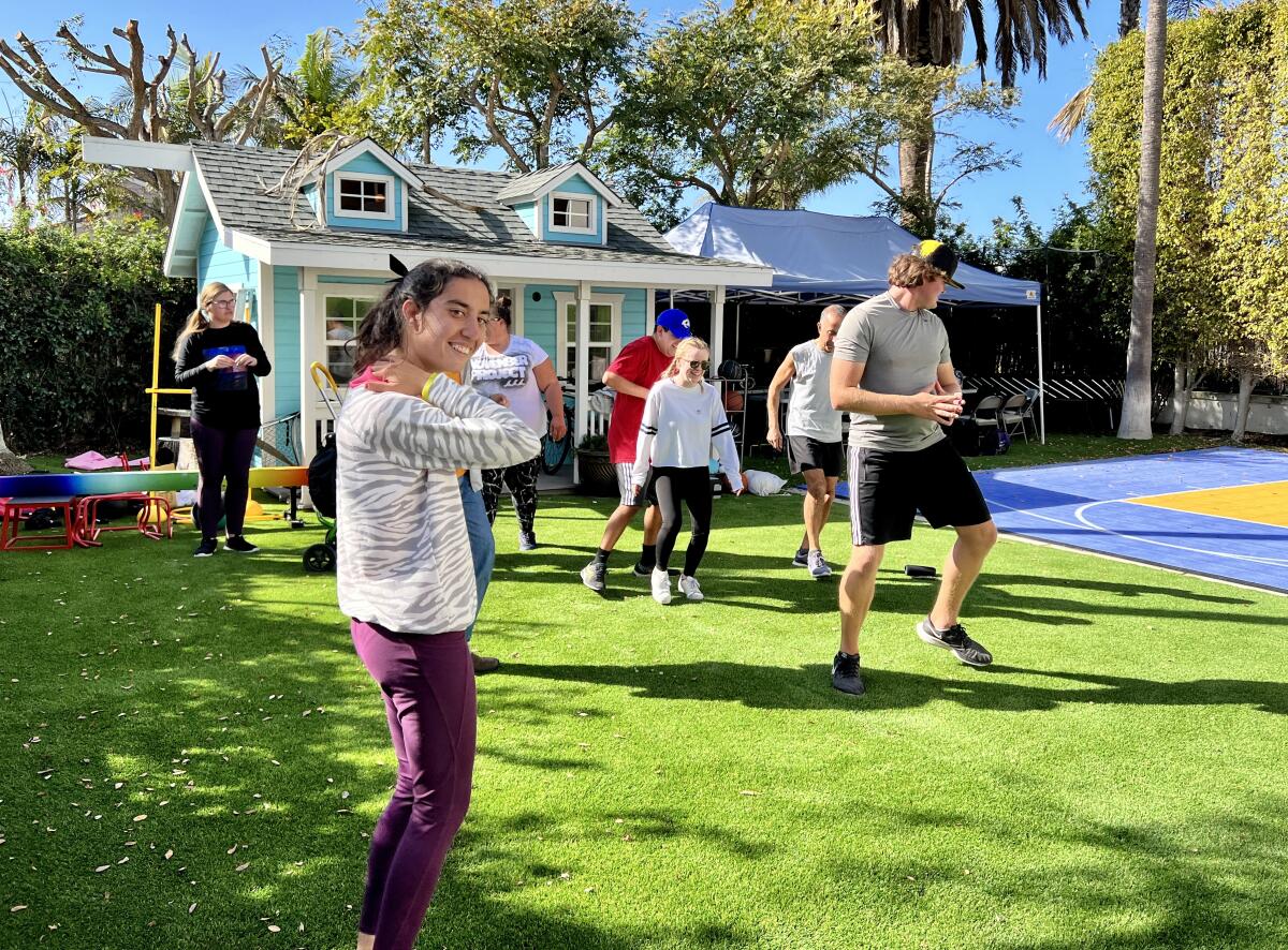 After Nikki Pousti (foreground) showed signs of anxiety, her parents began hosting a program in their backyard to help.