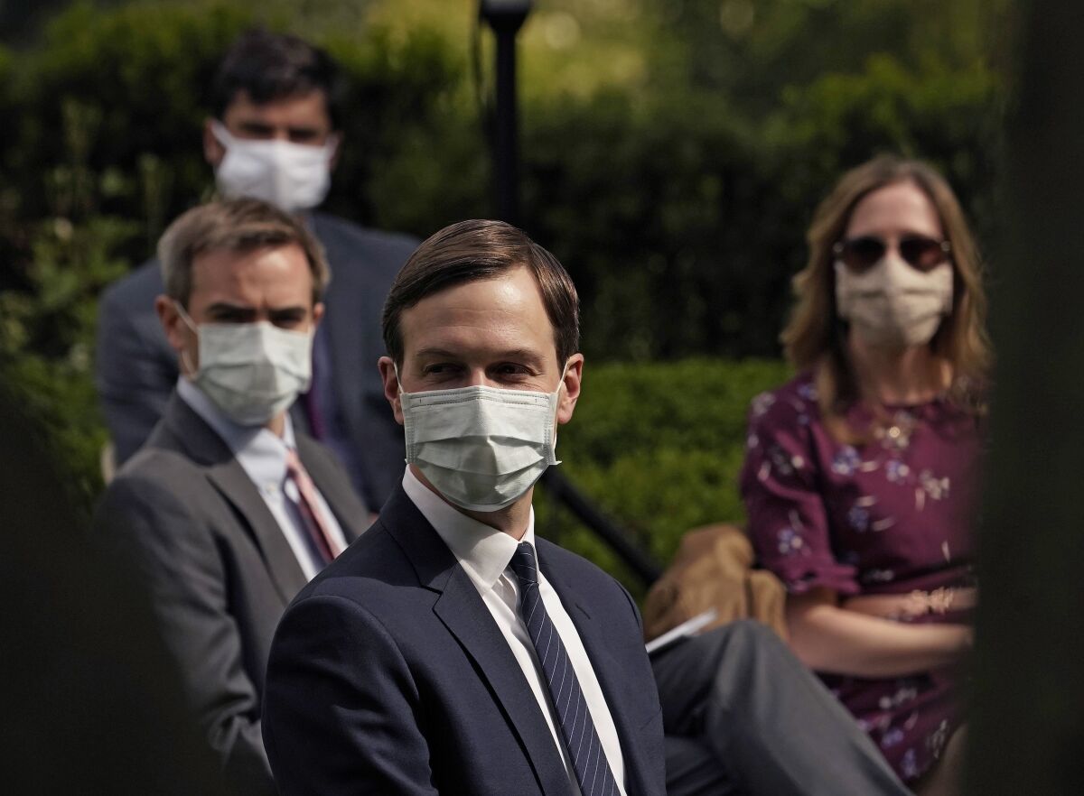 White House advisor Jared Kushner and others wore face masks while attending a news conference about coronavirus testing in the Rose Garden of the White House on Monday.