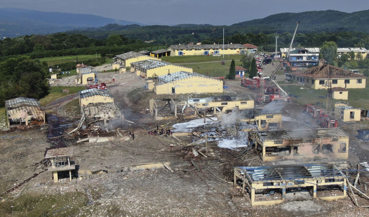 A view of destroyed buildings at a fireworks factory following a fire after an explosion outside the town of Hendek, Sakarya province, northwestern Turkey, Friday, July 3, 2020. There were an estimated 150 workers at the factory, Gov. Cetin Oktay Kaldirim told state-run Anadolu Agency. Several firefighters and ambulances were sent to the factory, which is away from residential areas. However, explosions were continuing, hampering efforts to bring the fire under control.The cause of the blast wasn't immediately known. (DHA via AP)