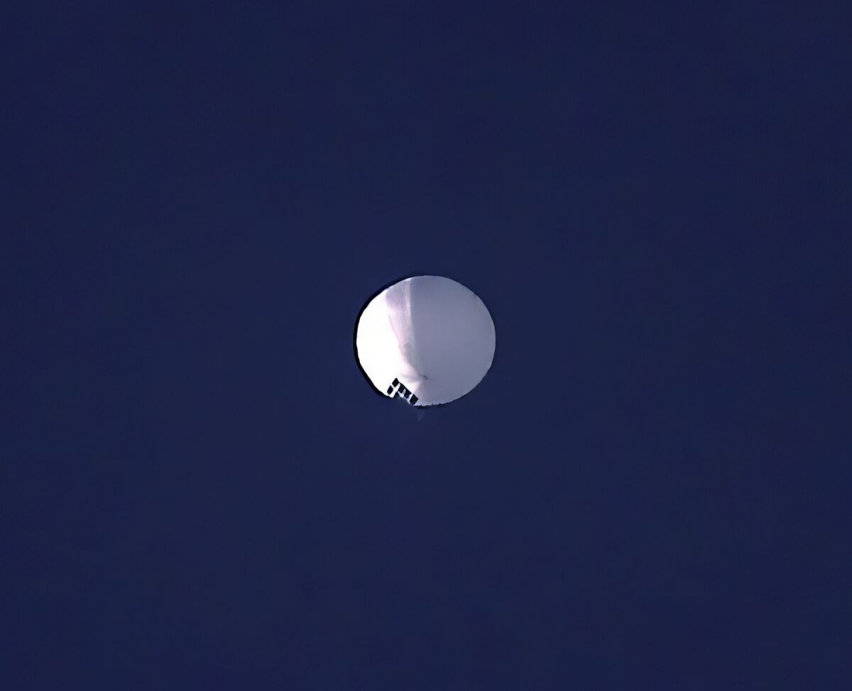 Large white balloon seen against blue sky
