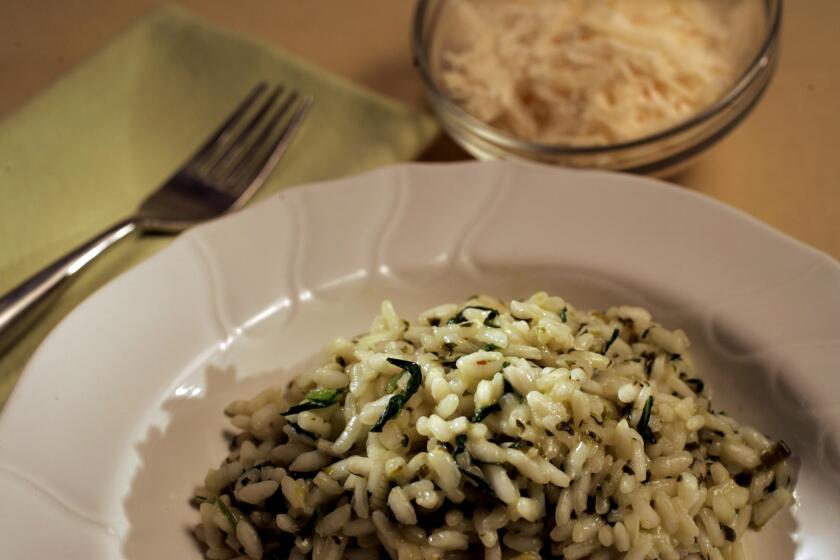 108634.FO.0315.food Risottos: spring herb risotto w bowl of parmesan.