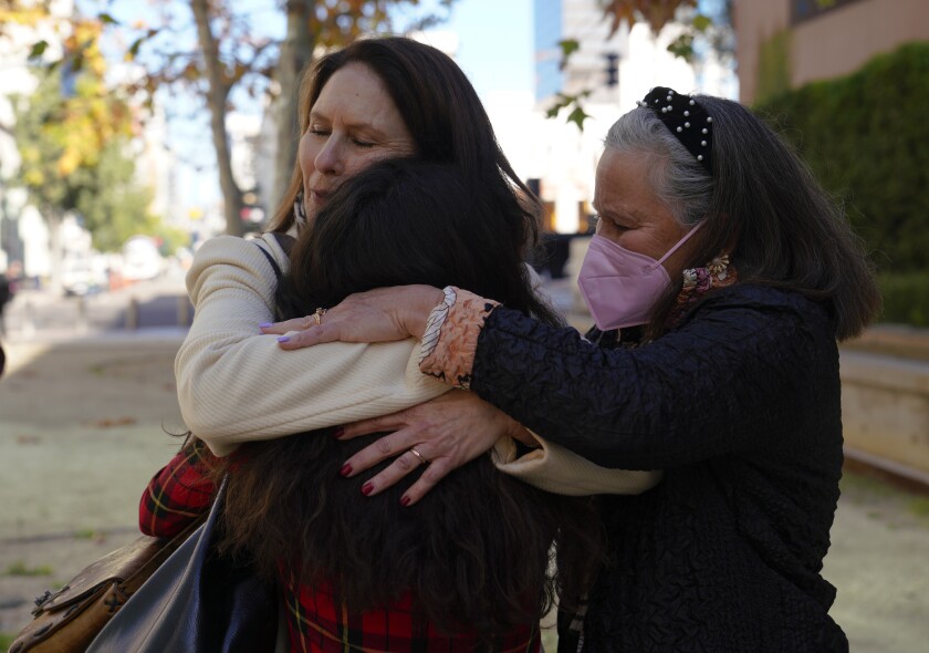Hannah Kaye is comforted by her aunts outside court