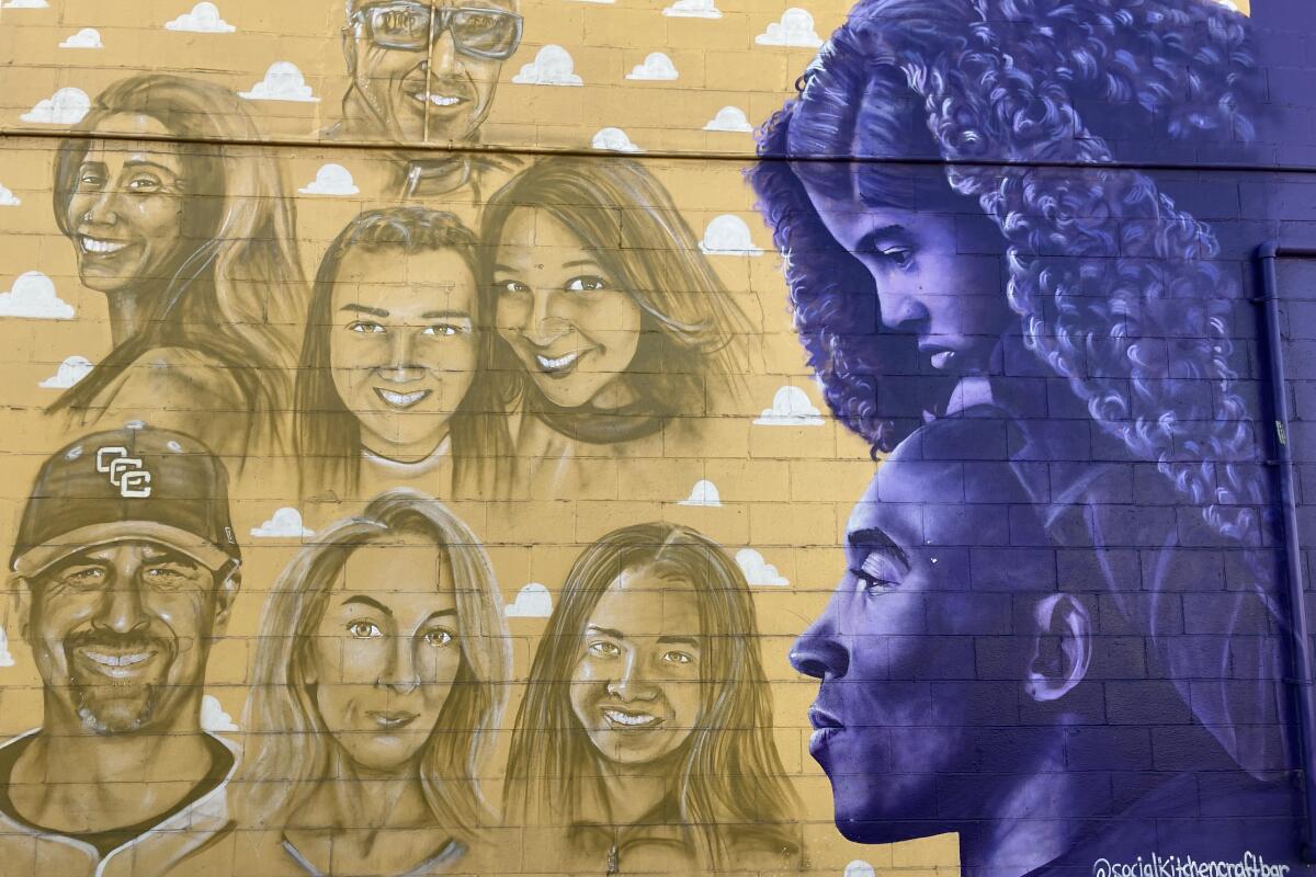 A Costa Mesa mural shows the images of the victims of a Jan. 26, 2020, helicopter crash