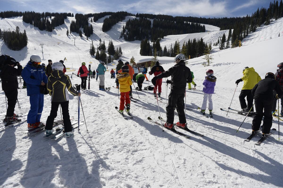 Skiers prepare for their day at the base of Vail in the Mountain Plaza area. Resorts in Colorado are now closed due to the coronavirus.