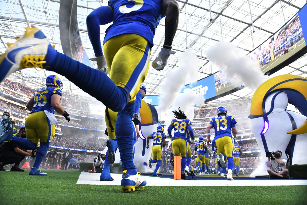 Rams players take the field before the NFC championship game against the 49ers.