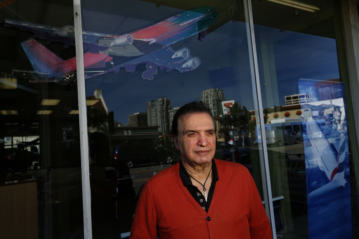 Farhad Besharati, owner of travel agency ATT Vacation on Westwood Boulevard, attributes his decline in business to recent arrests of dual citizens in Iran.