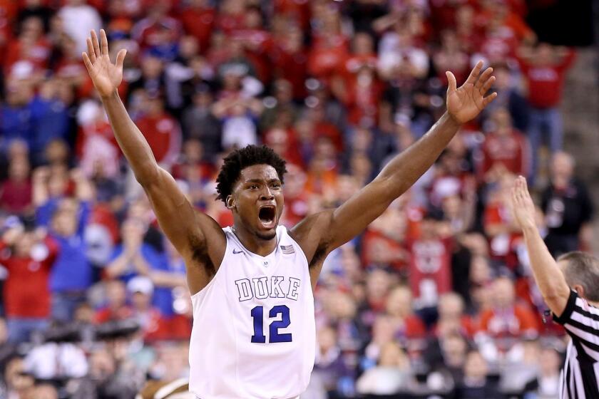 Duke freshman Justise Winslow celebrates after the Blue Devils' 68-63 victory in the national championship game over the Wisconsin Badgers.