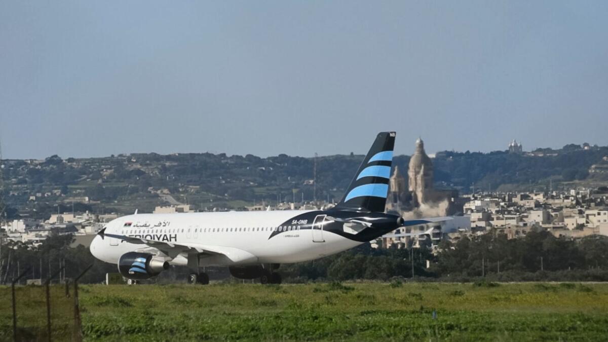 An Afriqiyah Airways plane from Libya stands on the tarmac at Malta's Luqa International airport on Dec. 23.