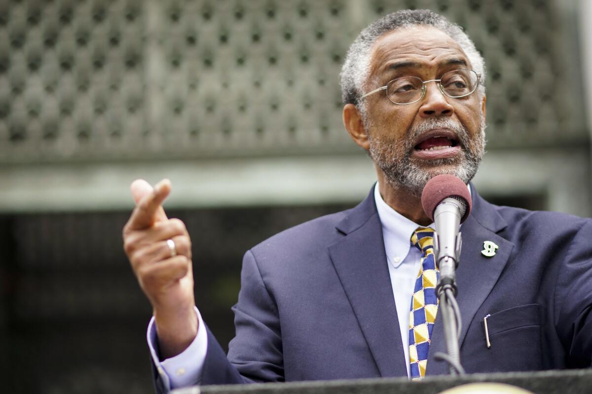 Los Angeles City Councilman Curren Price speaks during a City Hall news conference Wednesday about President Trump's termination of temporary protected status for some immigrants.