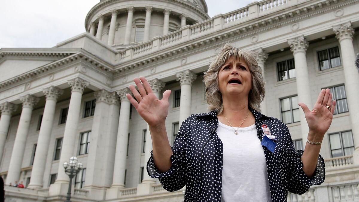 Jeanette Finicum, the widow of Robert "LaVoy" Finicum, speaks with reporters during a rally on March 5, 2016, at the Utah State Capitol, in Salt Lake City.