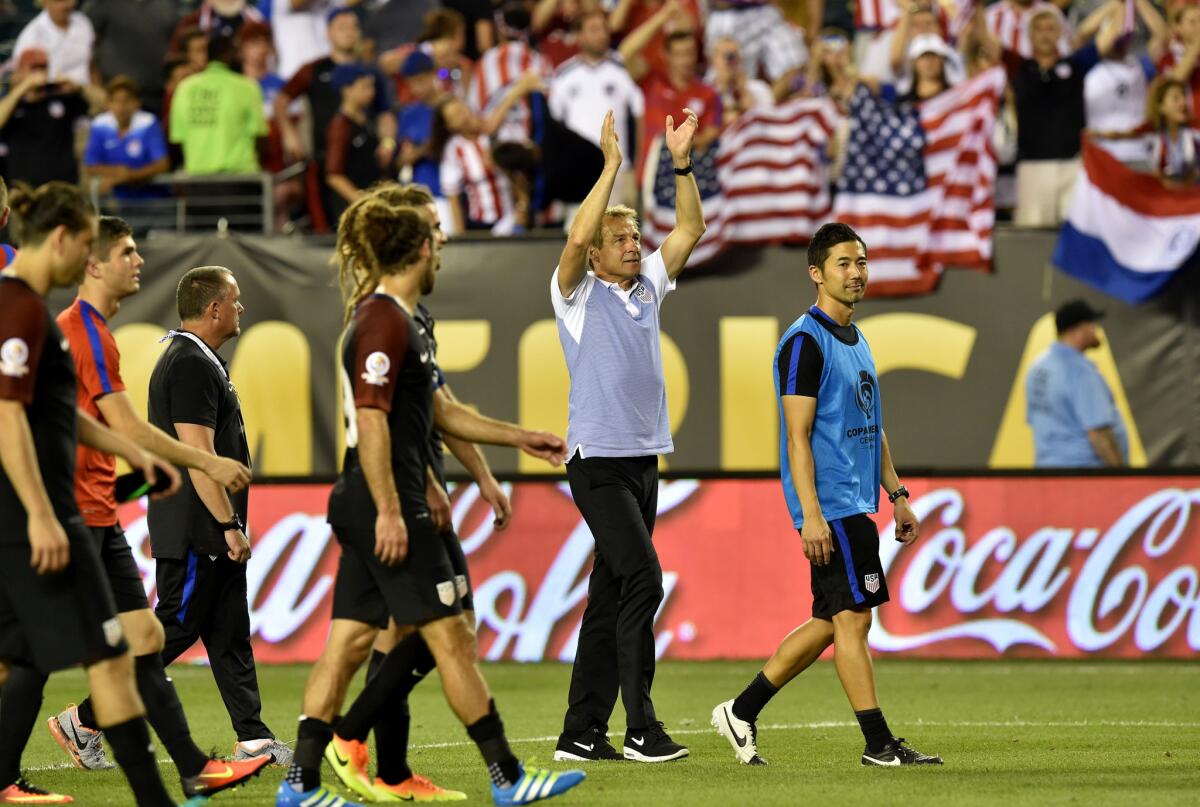 U.S. Coach Juergen Klinsmann, second from right, acknowledges the crowd after his team's 1-0 victory over Paraguay in a Copa America Centenario match on June 11.