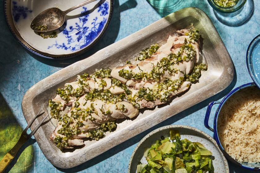 LOS ANGELES, CALIFORNIA, JULY 28, 2021: Poached Chicken with Ginger-Mint Sauce and Sauteed Lettuce for the August Week of Meals story by Ben Mims, photographed on Wednesday, July 28, 2021, at Proplink Studios in Arts District Los Angeles. (Silvia Razgova / For The Times) ATTN: 815461-la-fo-week-of-meals-august-2021