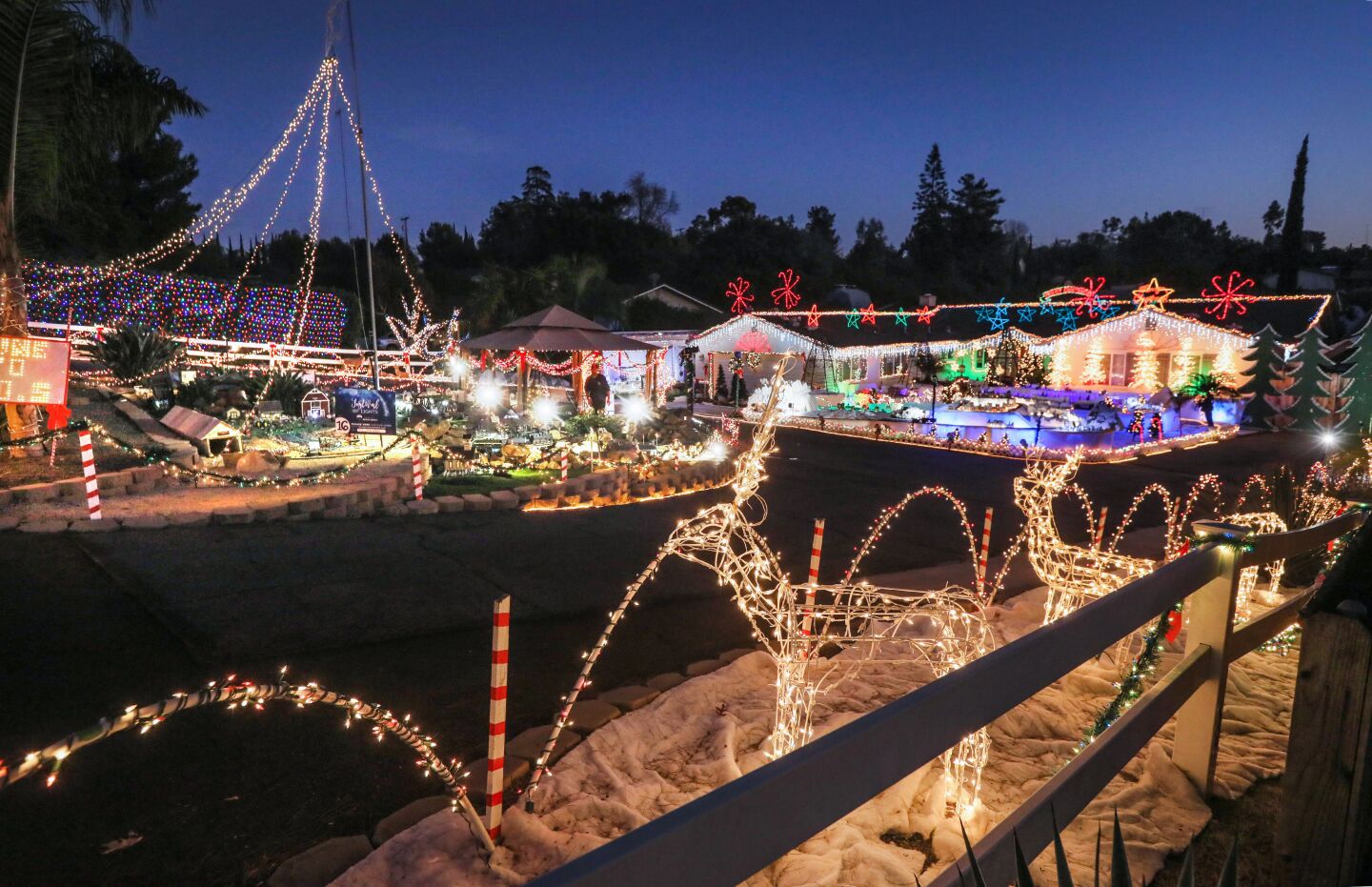Christmas decorations light up the home of Mack Schreiber on Reche Road in Fallbrook.