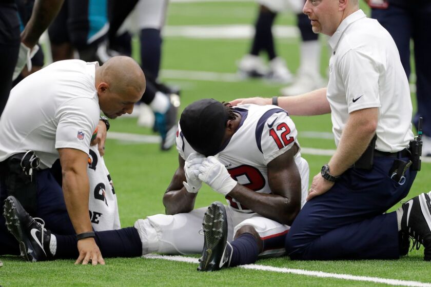 Houston Texans wide receiver Bruce Ellington (12) is treated after an injury during the second half of an NFL football game Sunday, Sept. 10, 2017, in Houston. (AP Photo/David J. Phillip)