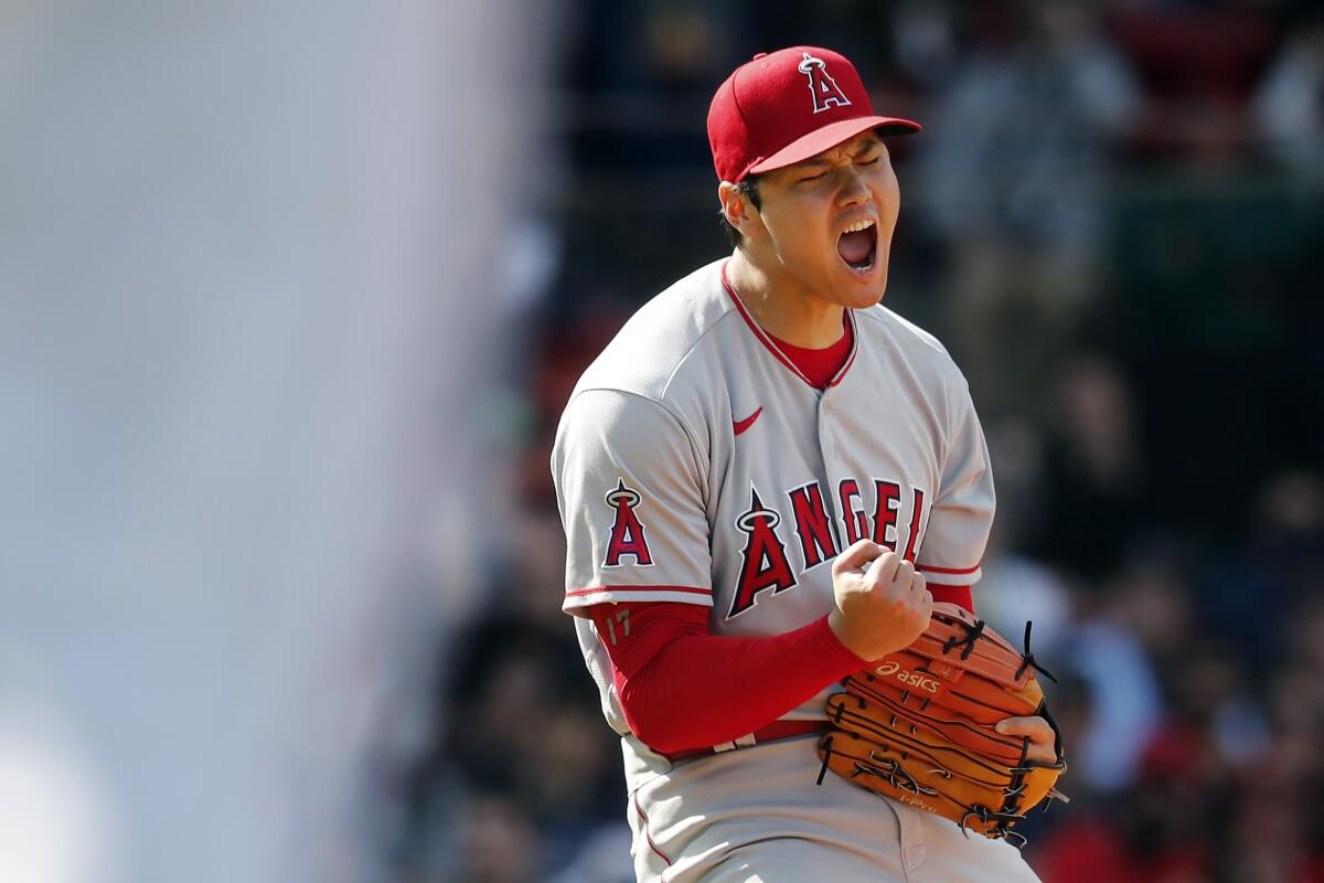 Angels pitcher Shohei Ohtani celebrates after striking out Boston's Trevor Story.
