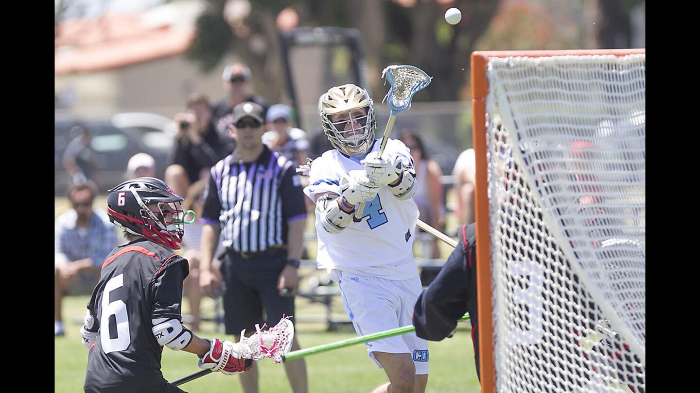 CDM's Will Favreau shoots and scores to tie the game 3-3 during game action against San Clemente on Saturday.