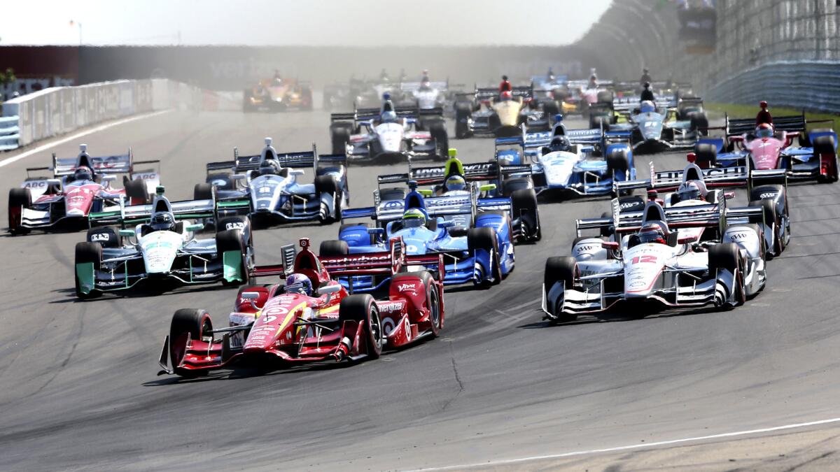 IndyCar driver Scott Dixon leads the field through Turn 9 at Watkins Glen on Sunday.