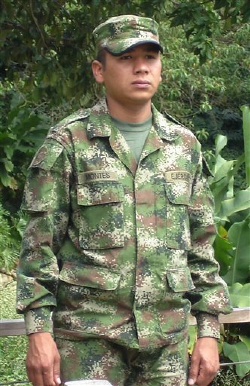 Soldier Luis Esteban Montes, 24, poses in uniform in Rionegro, Colombia, Monday, Oct. 27, 2008. According to Montes, in April 2007 some of his comrades from the Antelope Company of the 31st Rifle Batallion, 11th Brigade, 7th Division, where he was serving, killed his half brother to register him as a rebel slain in combat. Five of Montes' fellow soldiers now face a criminal probe in his brother's death, joining some 480 soldiers under investigation for about 1,000 extrajudicial killings during the presidency of President Alvaro Uribe. (AP Photo/Mauricio Builes, Revista Semana)