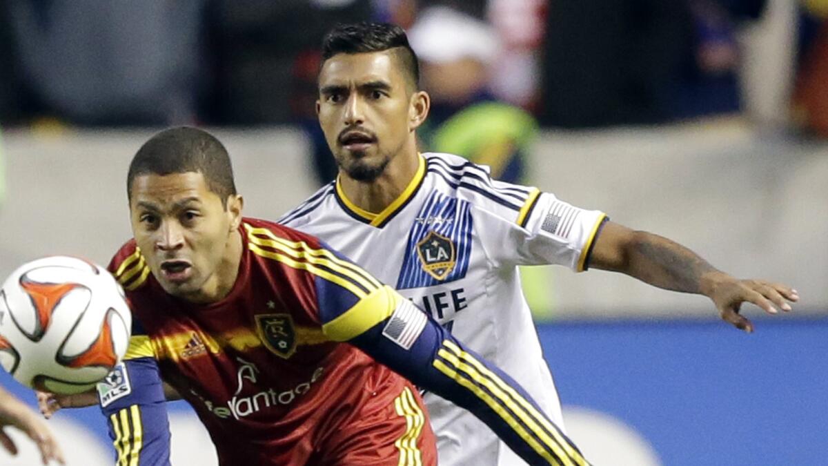 Galaxy defender A.J. DeLaGarza, top, defends against Real Salt Lake forward Alvaro Saborio during the first half of an MLS Western Conference semifinal match on Nov. 1.