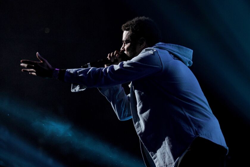 Hip-hop artist J. Cole, shown performing in New York in October, used an appearance Wednesday on "Late Night With David Letterman" to do his Ferguson, Mo.-inspired song "Be Free."
