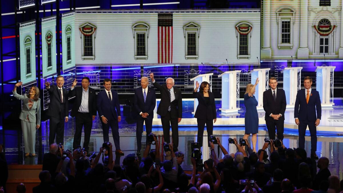 Democratic presidential candidates wave as they enter the stage for the second night of the Democratic primary debate hosted by NBC News in Miami on June 27.