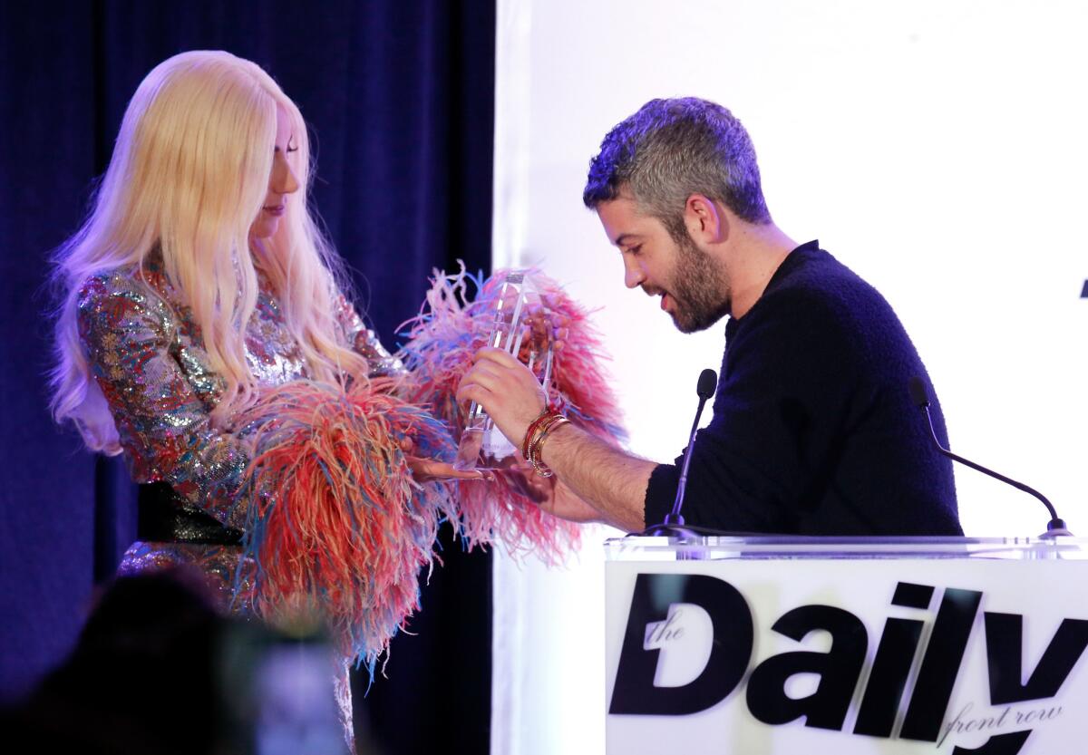 Lady Gaga presents Brandon Maxwell the designer debut award at the Daily Front Row's 2016 Fashion Los Angeles Awards at the Sunset Tower Hotel on Sunday.