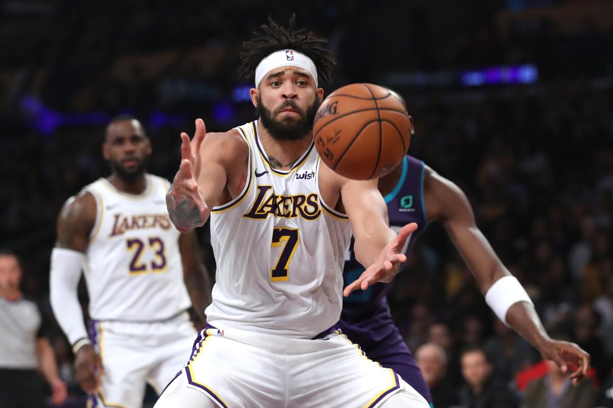 Lakers center JaVale McGee reaches for a rebound during a game against the Hornets on Oct. 27.