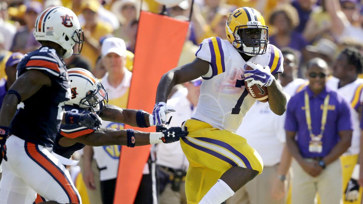 Louisiana State running back Leonard Fournette (7) breaks free for a 40-yard touchdown run in the first half against Auburn on Saturday in Baton Rouge.