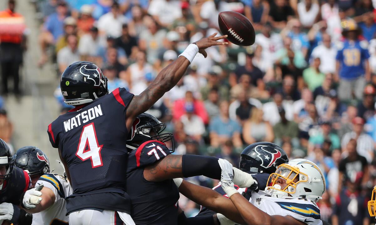 Houston Texans quarterback Deshaun Watson throws a pass.