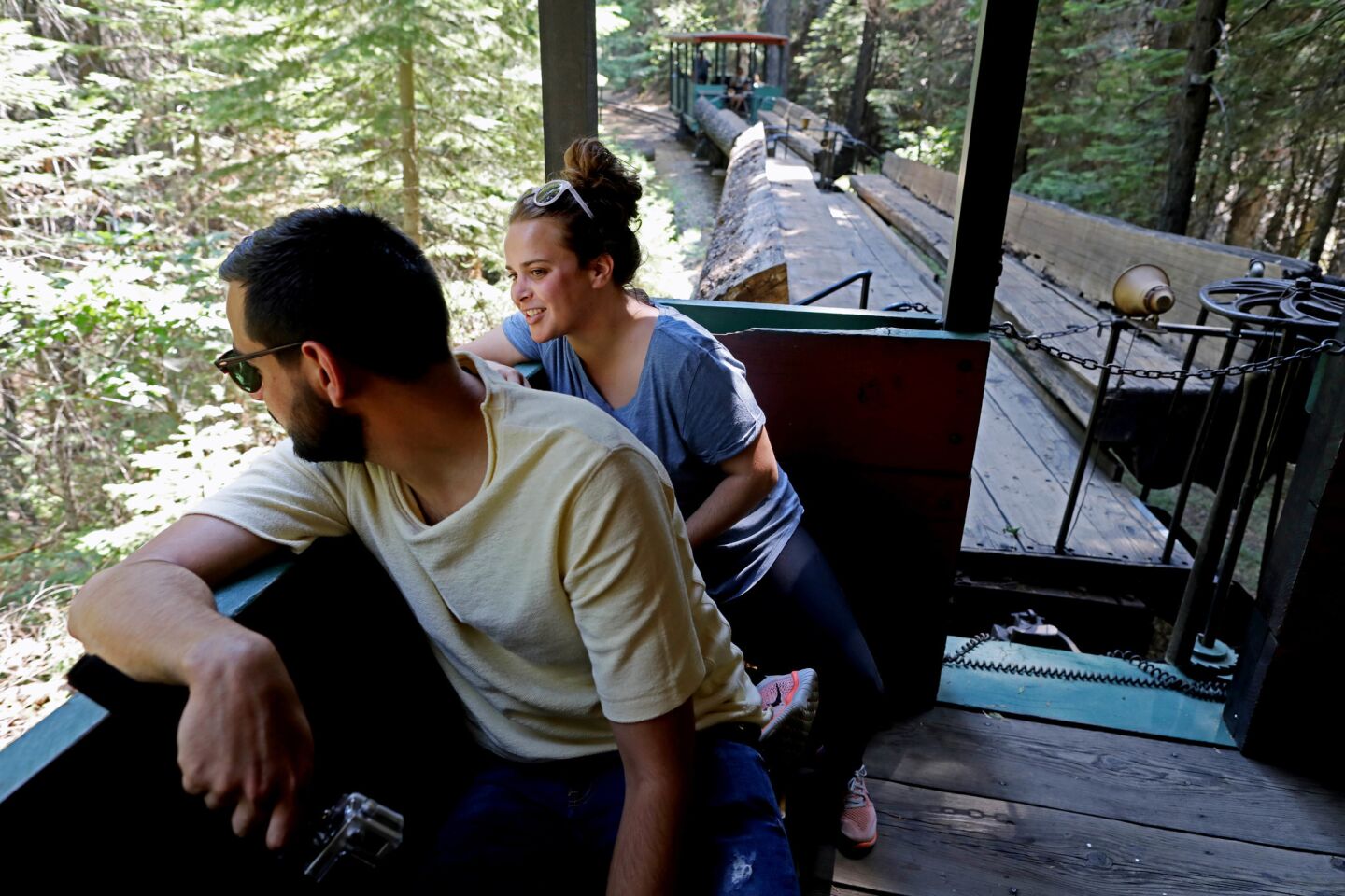 Benjamin Chevelle, 32, and girlfriend Celia Leonardo, 27, of Paris ride the Yosemite Mountain Sugar Pine Railroad in Fish Camp on Aug. 2. Chevelle and Leonardo planned their trip six months ago to visit Yosemite National Park. "We are a little bit disappointed because Yosemite is very different than other national parks," said Leonardo. There were only 10 guests on the train. Normally in July and August there would be 100-150 riders.
