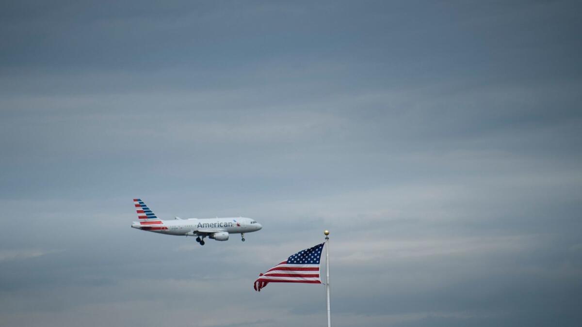 An American Airlines passenger jet approaches Ronald Reagan Washington National Airport in Arlington, Va, on May 9, 2019. Citing safety concerns, the U.S. on May 15, 2019, suspended all passenger and cargo air services to Venezuela.