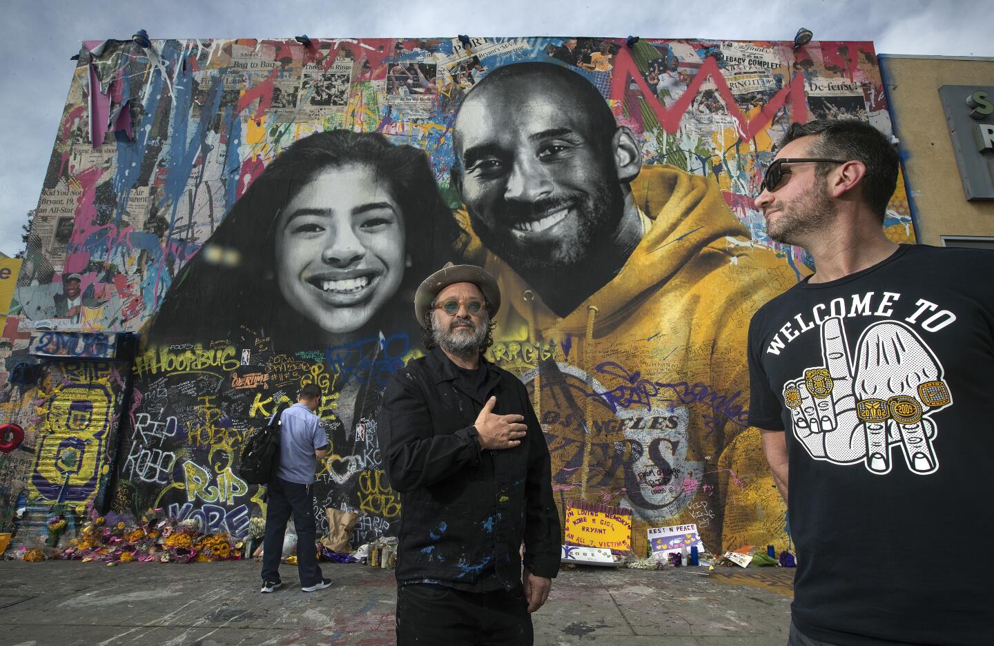 Artist Thierry "Mr. Brainwash" Guetta and Mike Asner in front of Guetta's mural in the 1200 block of South La Brea Avenue.