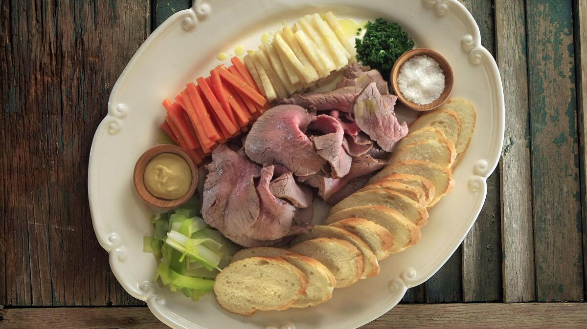 Boeuf a la ficelle served with carrots, parsnips, horseradish and mustard.