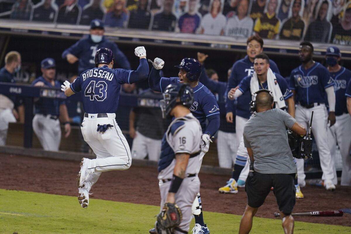 Tampa Bay Rays' Michael Brosseau (43) celebrates after hitting a solo home run during the eighth inning in Game 5 of the baseball team's AL Division Series against the New York Yankees, Friday, Oct. 9, 2020, in San Diego. (AP Photo/Gregory Bull)