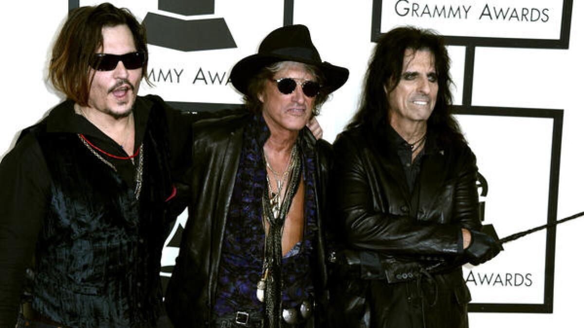 Johnny Depp, left, Joe Perry and Alice Cooper of music group the Hollywood Vampires.